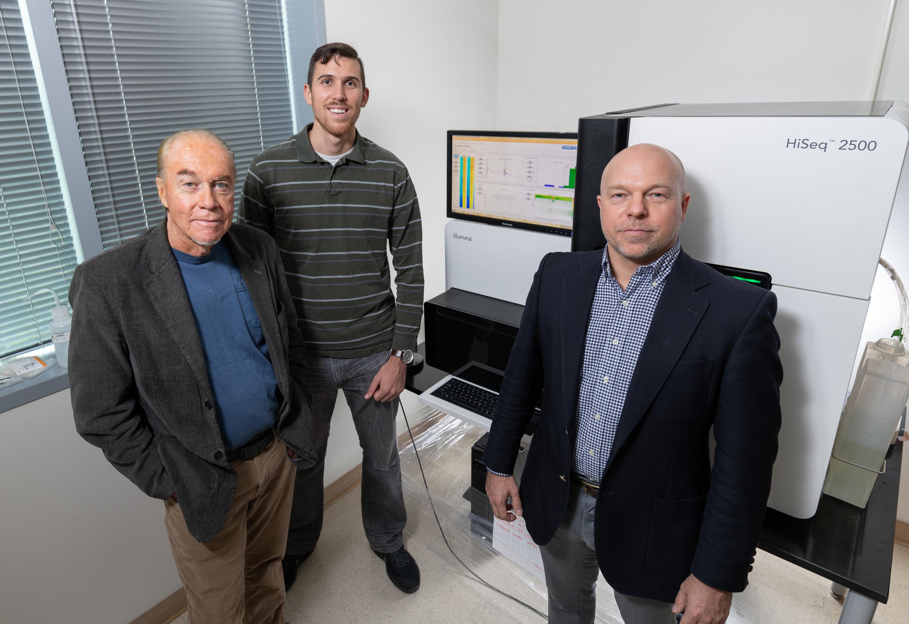 Georgia Tech researchers (l-r) John McDonald, Evan Clayton and Fredrik Vannberg are shown with sequencing equipment in Georgia Tech’s Petit Institute for Bioengineering and Bioscience. (Credit: Rob Felt, Georgia Tech)