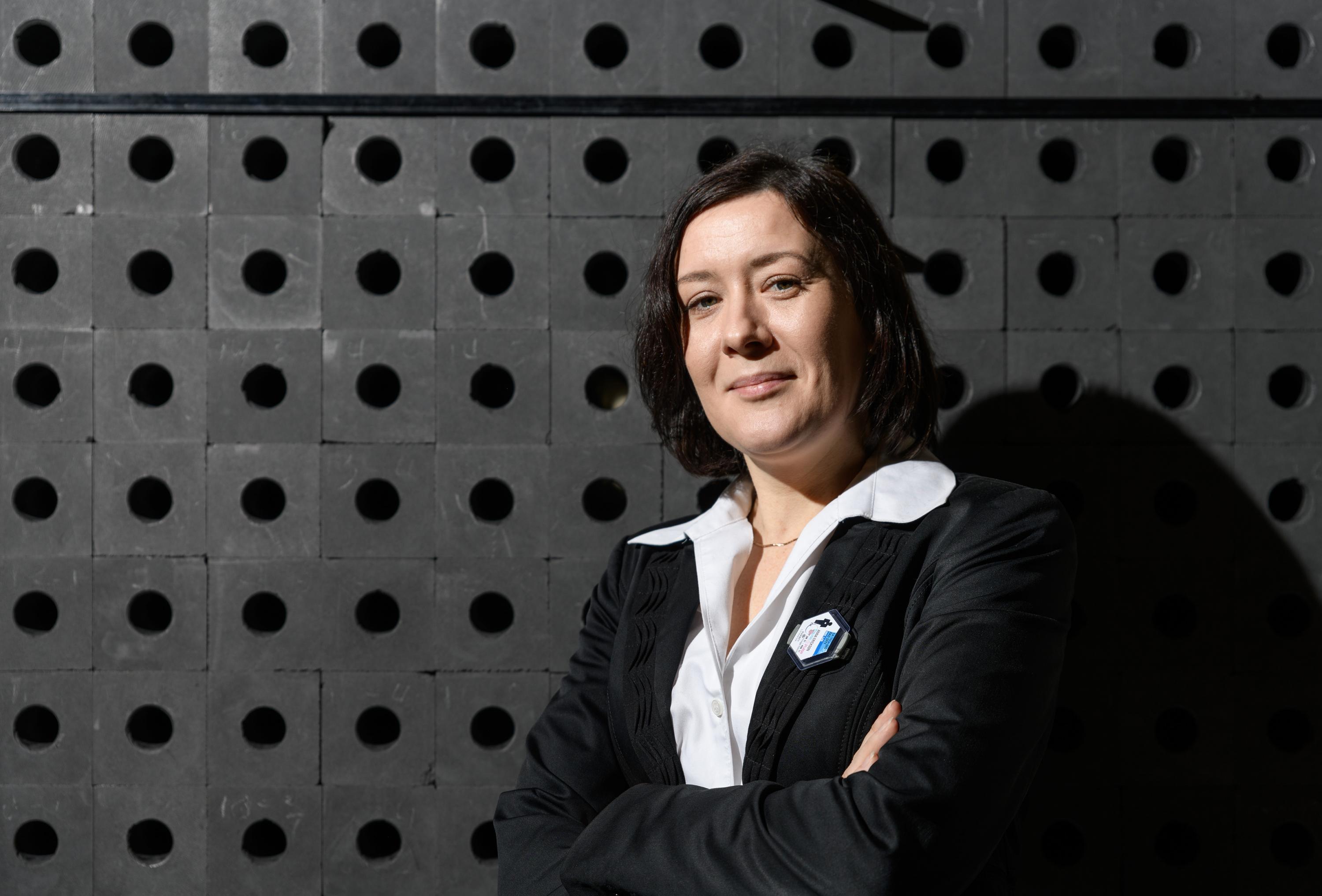 Associate Professor Anna Erickson shown with the subcritical graphite pile used to teach radiation physics concepts at Georgia Tech. (Photo: Rob Felt, Georgia Tech)