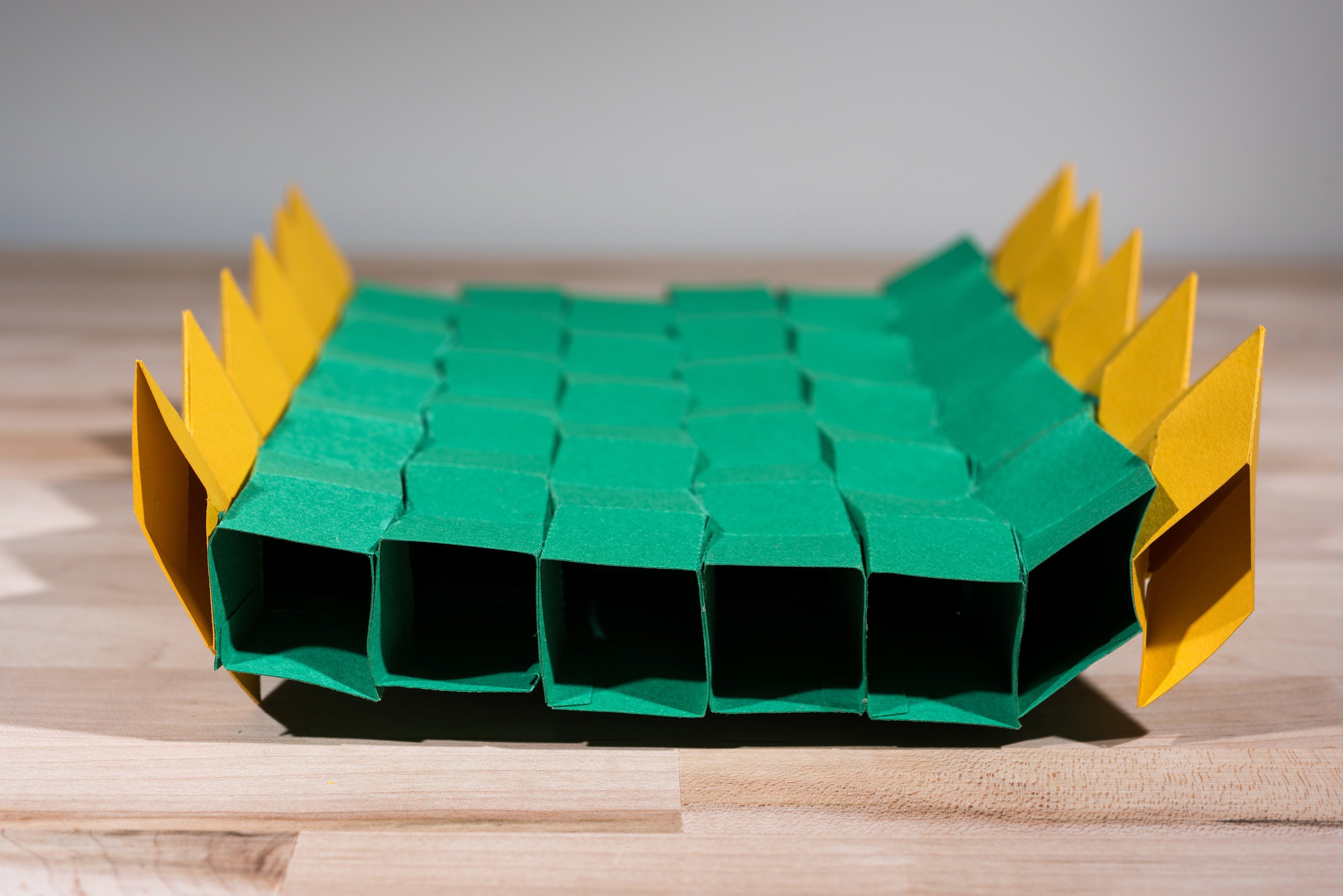 This origami bridge is made by combining multiple zippered tubes. Though made from paper, it can support a significant load. The structure could serve as a model for full-sized bridges that could be folded for delivery to disaster areas and then quickly expanded to full size. (Credit: Rob Felt, Georgia Tech)