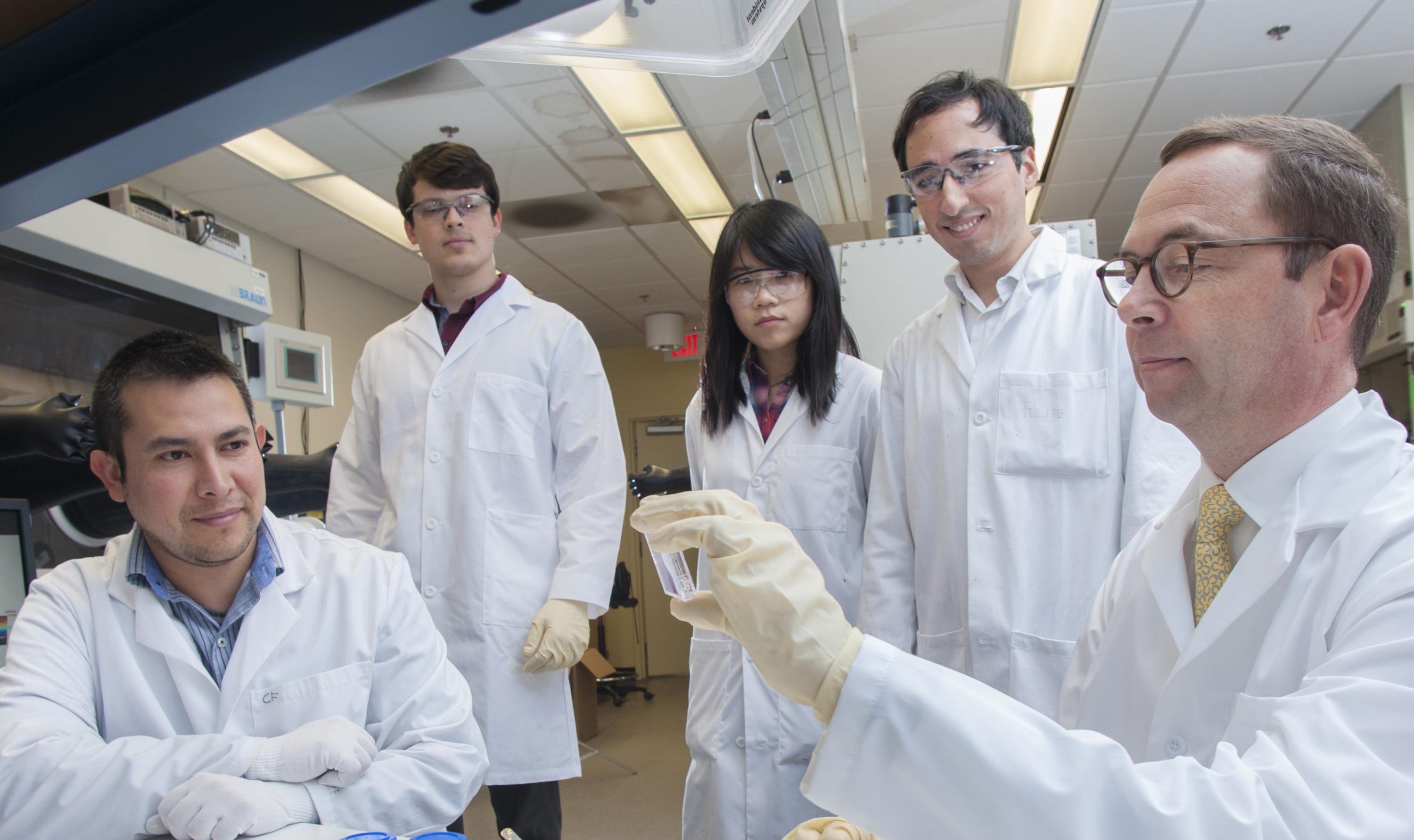 The leading team of scientists at Georgia Tech that developed the new solution-based electrical doping technique for organic semiconductors. Shown are (l-r) senior research scientist Canek Fuentes-Hernandez; graduate students Vladimir Kolesov, Wen-Fang Chou, Felipe Larrain; and professor Bernard Kippelen. (Credit: Christopher Moore, Georgia Tech)