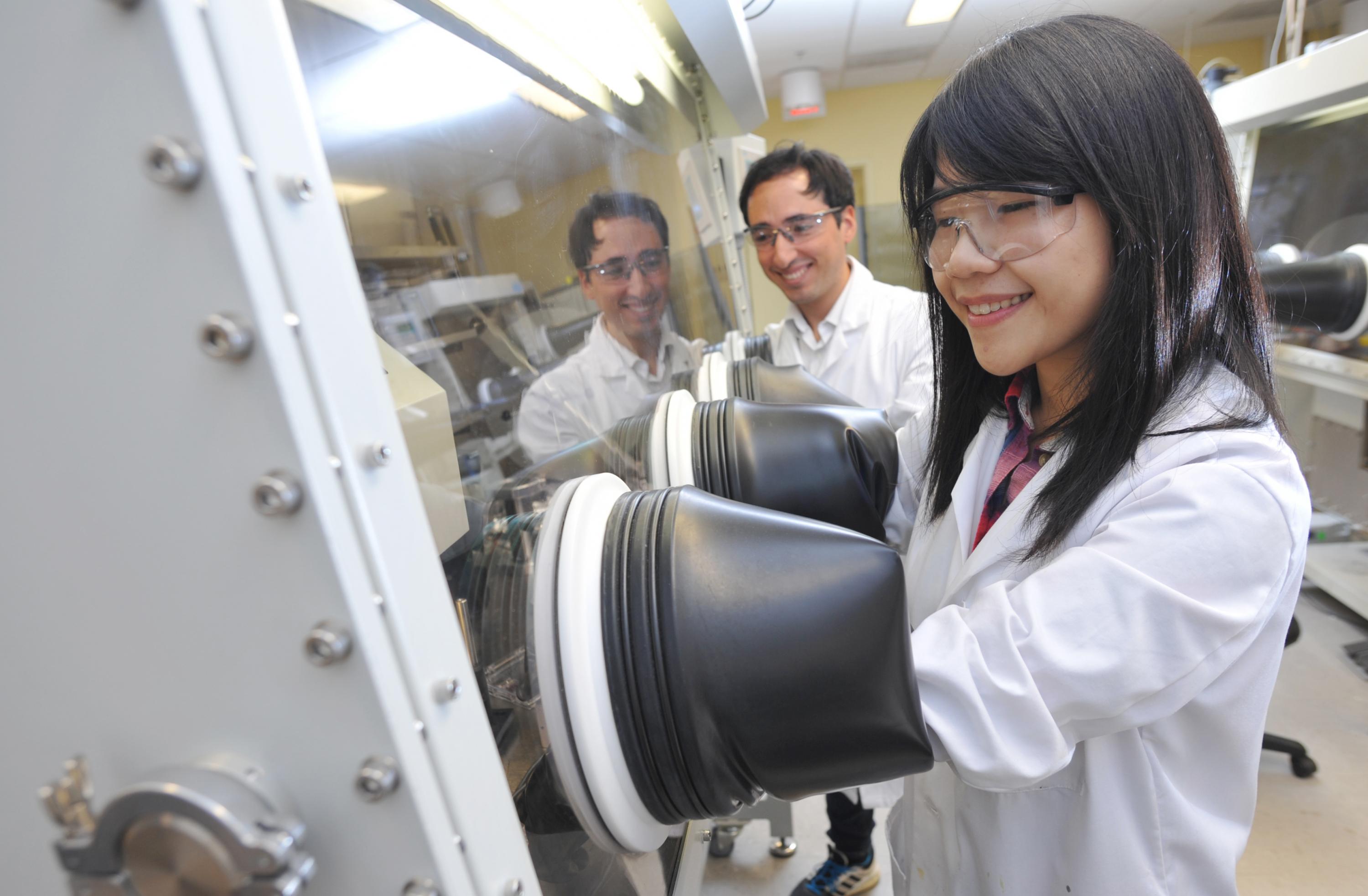 Graduate students Felipe Larrain and Wen-Fang Chou testing the performance of the single layer solar cells developed at Georgia Tech using a new electrical doping technique. (Credit: Christopher Moore, Georgia Tech)