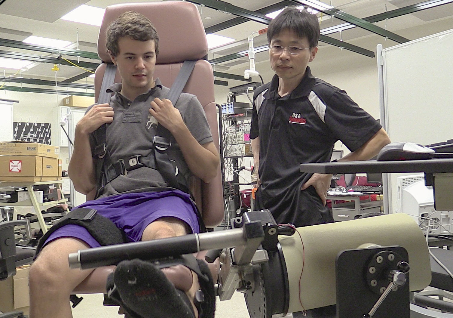 Minoru Shinohara, an associate professor in the School of Applied Physiology and one of the study's researchers, watches a student during a resistance exercise. 