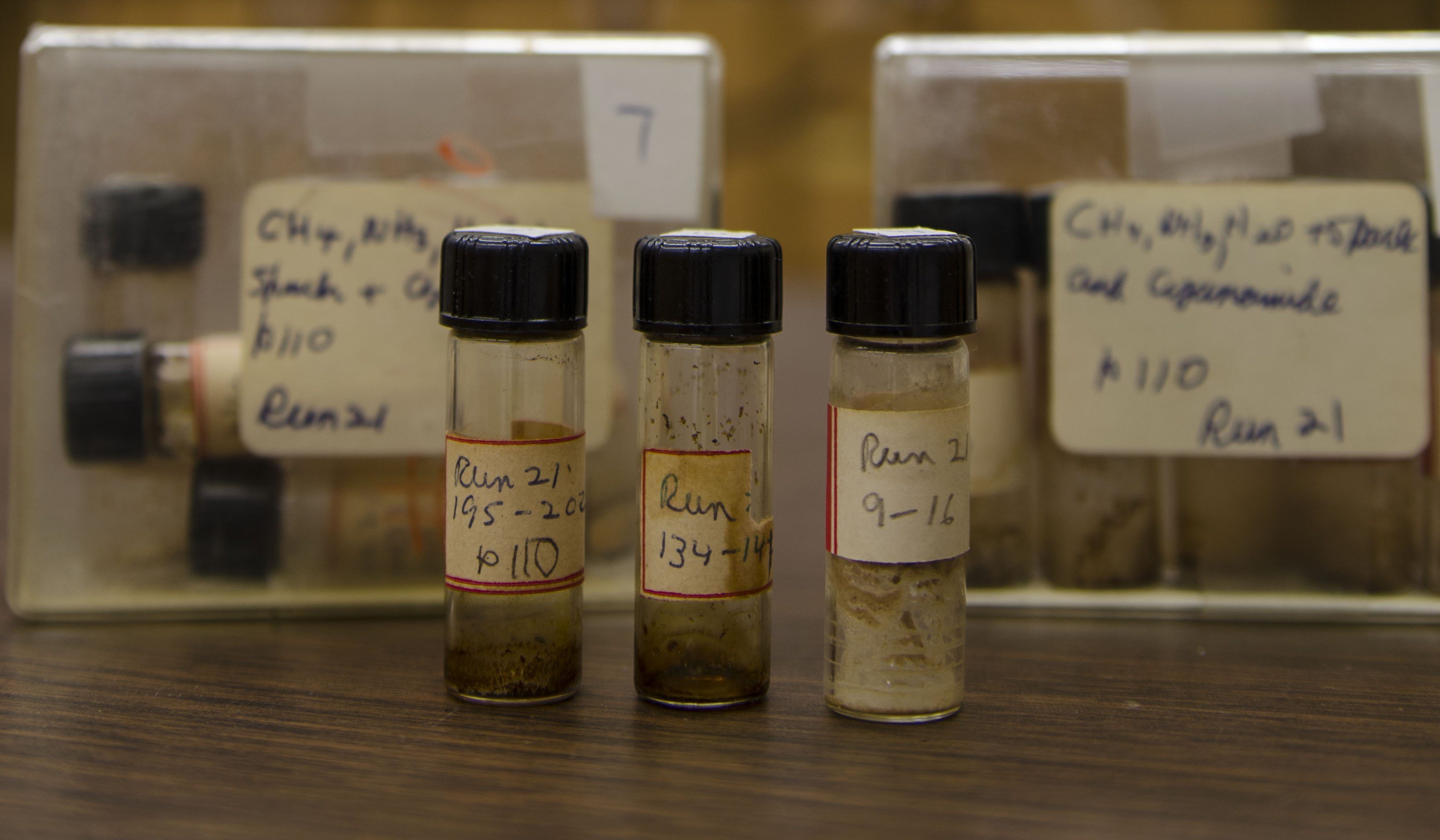 Vials contain samples of prebiotic materials created by Stanley Miller in 1958, labeled by Miller himself. Miller added a potential prebiotic condensation agent, cyanamide, during the course of the experiment. Cyanamide has been suggested to induce polymerization of amino acids into simple peptides which is an important set in chemical evolution and possibly the origin of life. For unknown reasons, Miller had never analyzed the samples. In a paper published in 2014, researchers at Georgia Tech and Scripps I