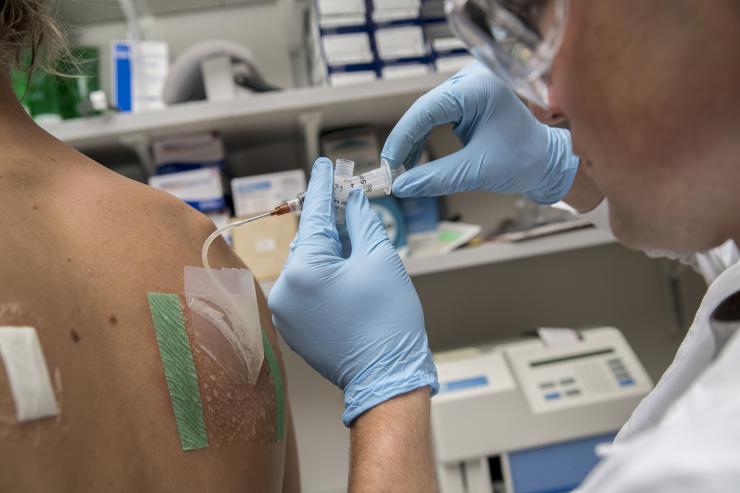 A research scientist withdraws sweat from a pouch on the back of a volunteer. Sweat is analyzed for electrolyte concentration among other biochemicals in Mindy Millard-Stafford's exercise physiology lab in Georgia Tech's School of Biological Sciences. This photo is not connected with any particular study. Credit: Georgia Tech / Christopher Moore